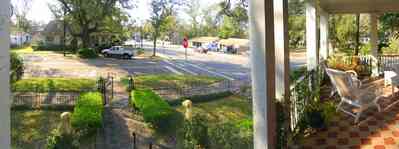 East-Hill:-McAlpin-Shop_09.jpg:  oak trees, front porch, traditional style, brick sidewalk, box hedge, wrought iron fence, 