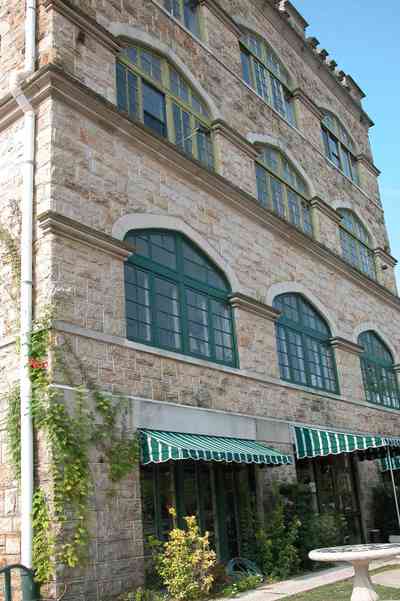 East-Hill:-Tower-East:-Old-Sacred-Heart-Hospital_33.jpg:  fir tree, stone battlements, entrance patio, hospital