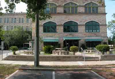 East-Hill:-Tower-East:-Old-Sacred-Heart-Hospital_34.jpg:  fir tree, stone battlements, entrance patio, hospital