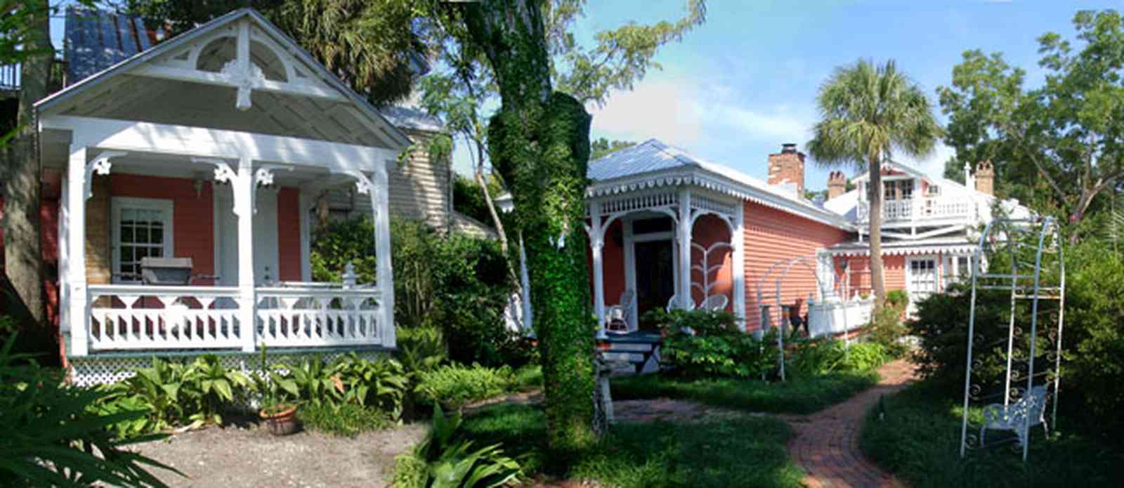 Pensacola:-Seville-Historic-District:-433-East-Zaragoza-Street_10.jpg Pensacola:-Seville-Historic-District:-433-East-Zaragoza-Street_10.jpg: victorian cottage, wicker furniture, victorian house, garden house, brick sidewalk, gingerbread trim, pyramidal roof, four-square georgian victorian house
